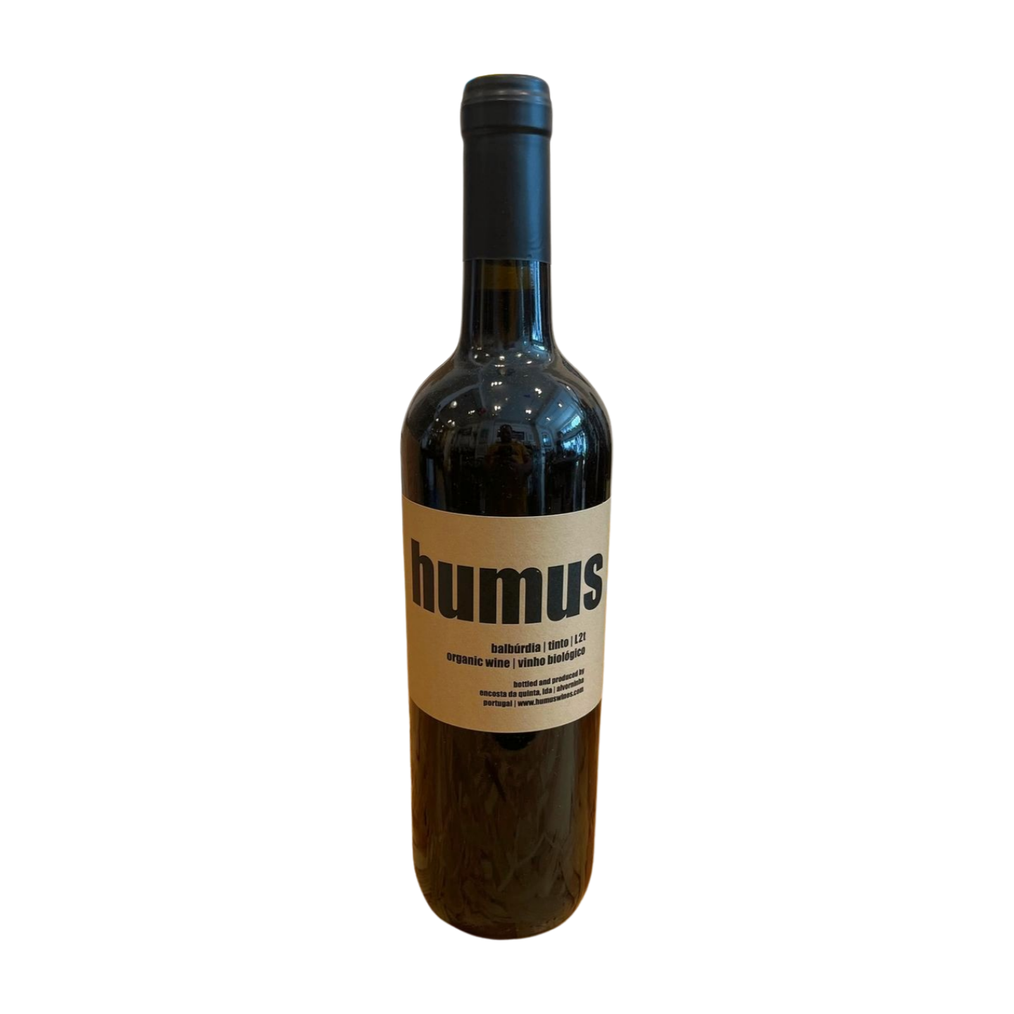 A bottle of Humus wine with a label that has the name 'humus' and some additional text, placed against a plain background.