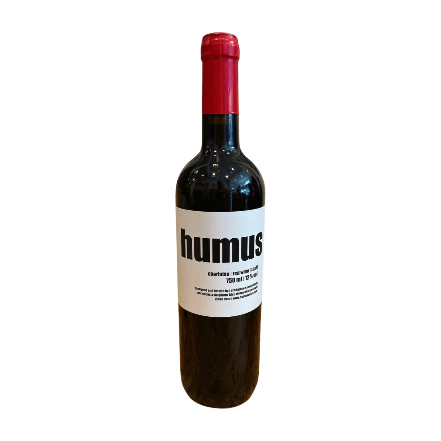 A bottle of red wine labeled 'Humus', with a red cap and a white label on a plain background.
